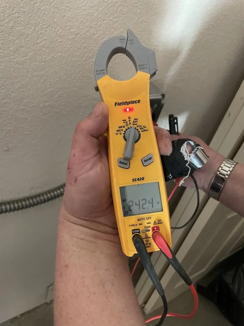 Voltage testing with clamp meter during Ceiling Fan Installation in Maiden